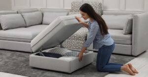 woman looking in couch ottoman storage