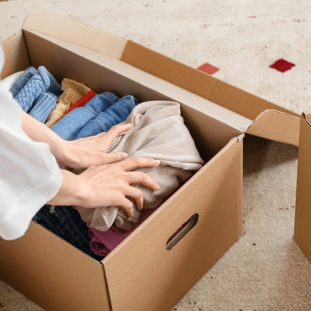 Packing clothes in a box