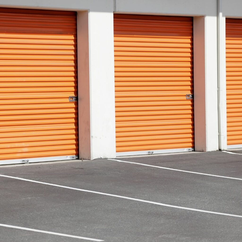 Outside of a storage facility with orange doors