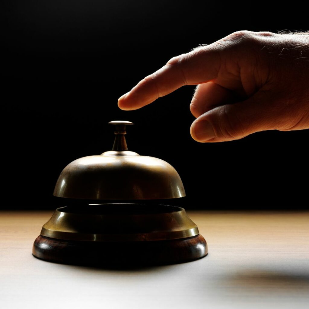 Hand ringing concierge bell